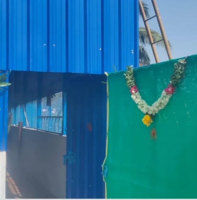 Shed inauguration with flower garland